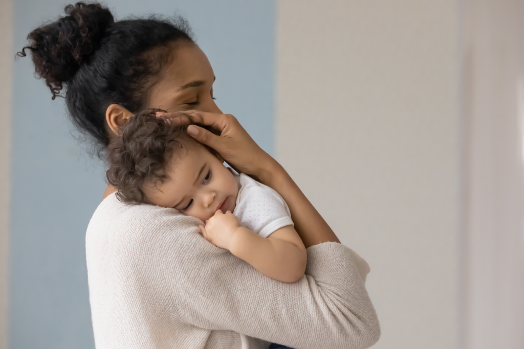Parent’s voice as a calming activity before sleep, signaling bedtime for toddlers.