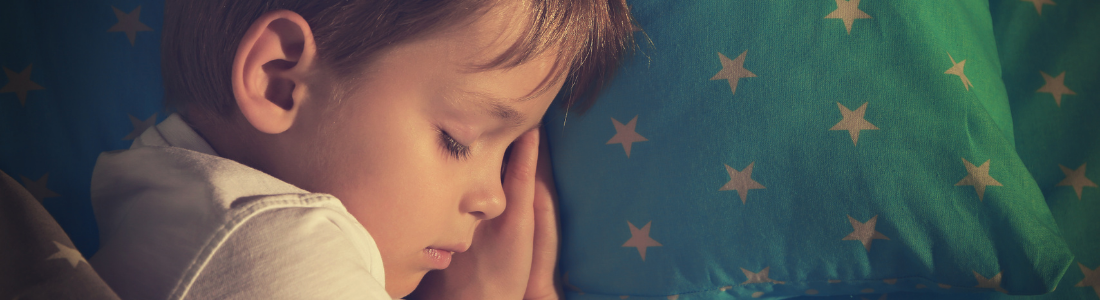 The photo shows a peaceful toddler sleeping, symbolizing the importance of sleep for kids in supporting comfort, growth, and healthy routines.