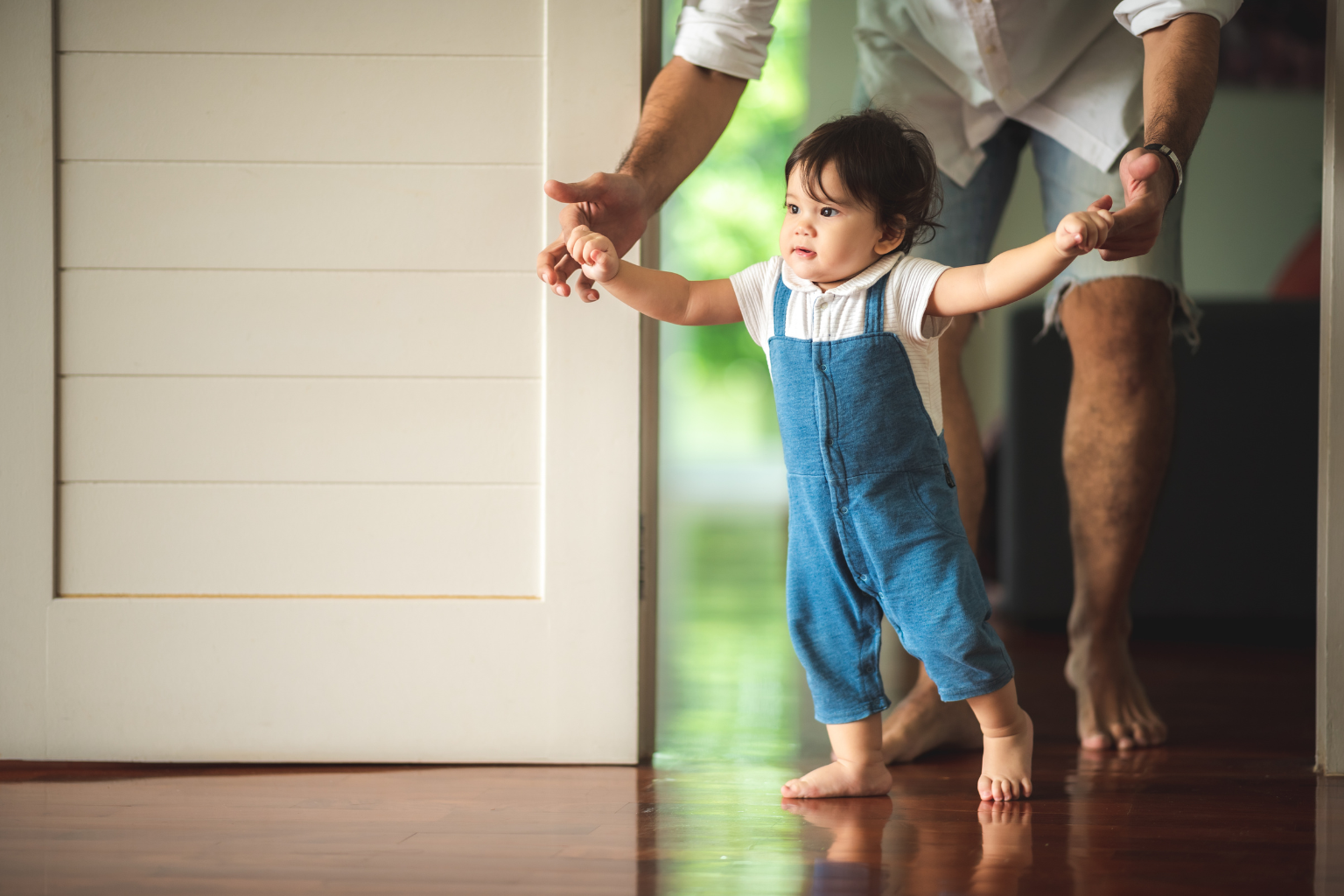 This photo highlights an active moment that can be part of a calming wind-down during the bedtime routine for toddlers, showcasing bonding and physical activity before settling down.