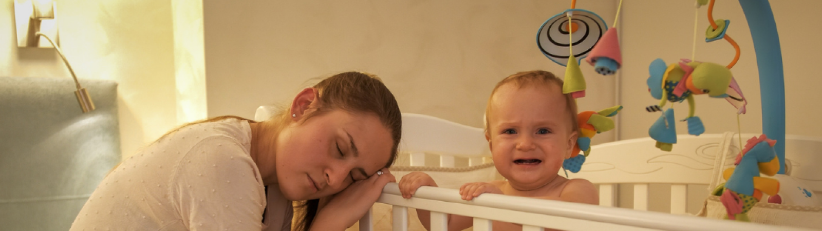 The purpose of this photo is to highlight the challenges parents face in building healthy sleep habits for toddlers, showing the emotional struggle that can come with bedtime routines and sleep regression.